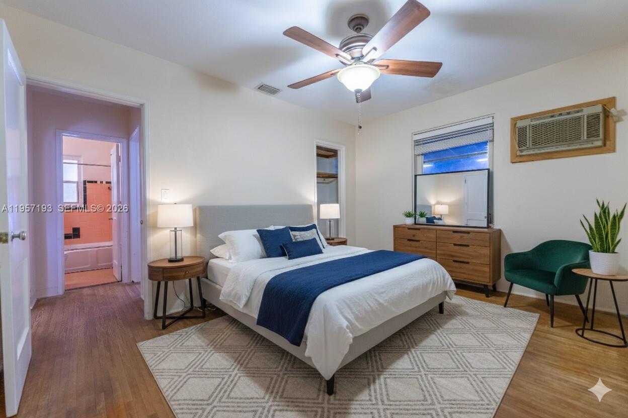 4381 Southwest 5th Terrace Miami, FL 33134 - Photo 15 of 34 a bedroom with a bed and a chandelier