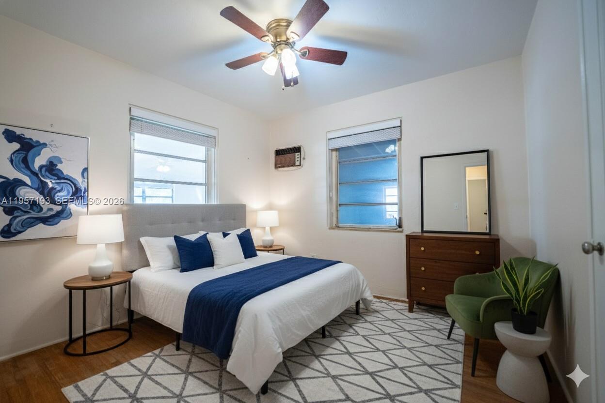 4381 Southwest 5th Terrace Miami, FL 33134 - Photo 18 of 34 a bedroom with a bed and a chandelier