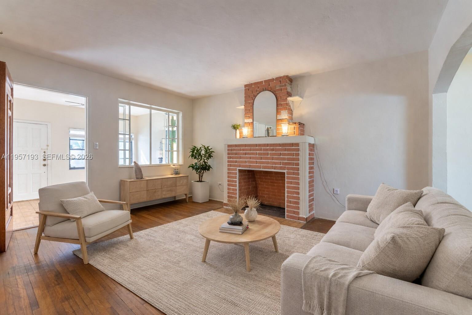 4381 Southwest 5th Terrace Miami, FL 33134 - Photo 5 of 34 a living room with furniture and a fireplace