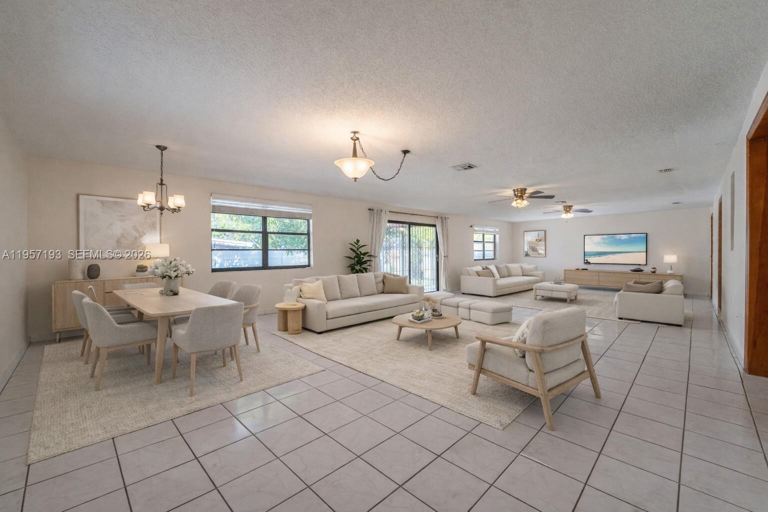 4381 Southwest 5th Terrace Miami, FL 33134 - Photo 7 of 34 a living room with furniture and a dining table with kitchen view