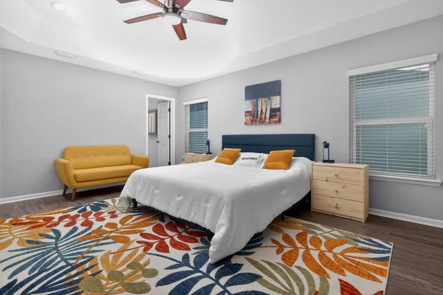 a bedroom with a bed and a dresser