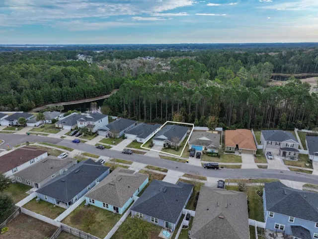 a view of roof with yard