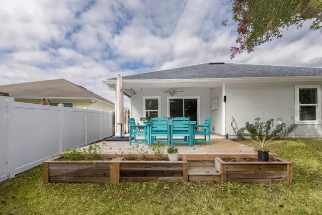 a front view of houses with yard