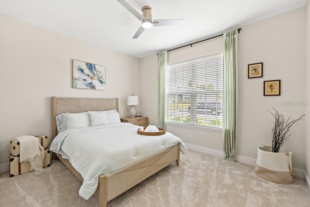5148 Foothills Preserve Loop Mount Dora, FL 32757 - Photo 19 of 54 a bedroom with a large bed and a window