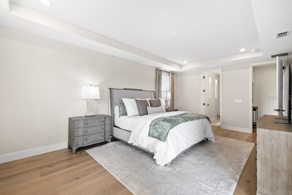 5148 Foothills Preserve Loop Mount Dora, FL 32757 - Photo 27 of 54 a bed room with a bed and a night stand