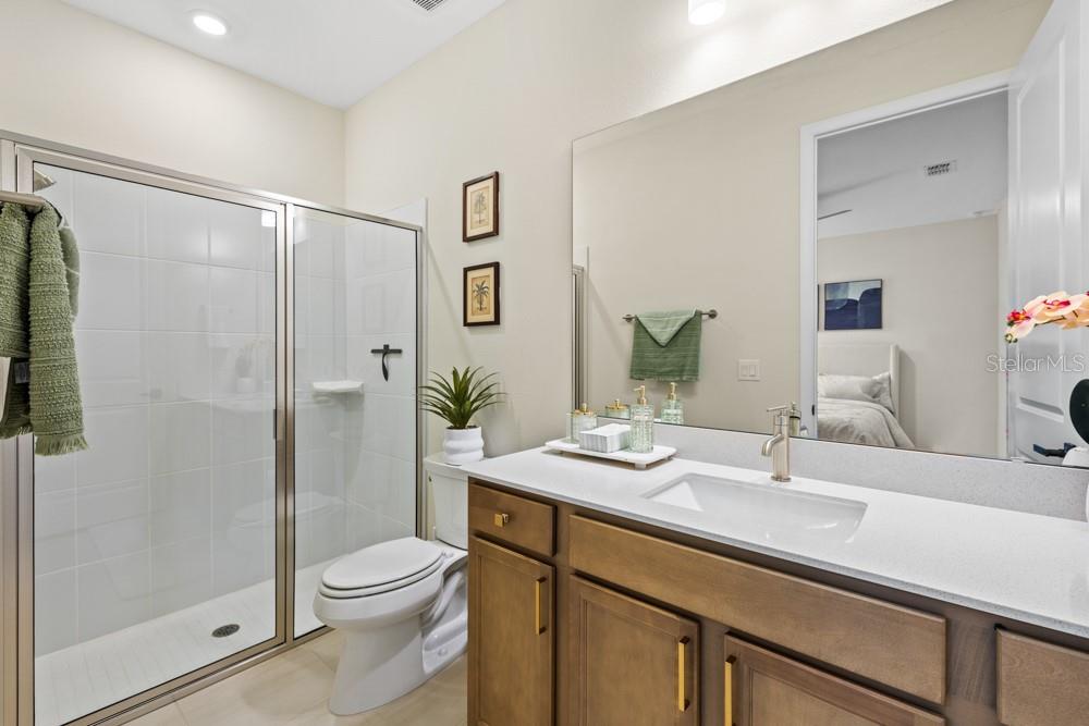 5148 Foothills Preserve Loop Mount Dora, FL 32757 - Photo 32 of 54 a bathroom with a sink a toilet and shower