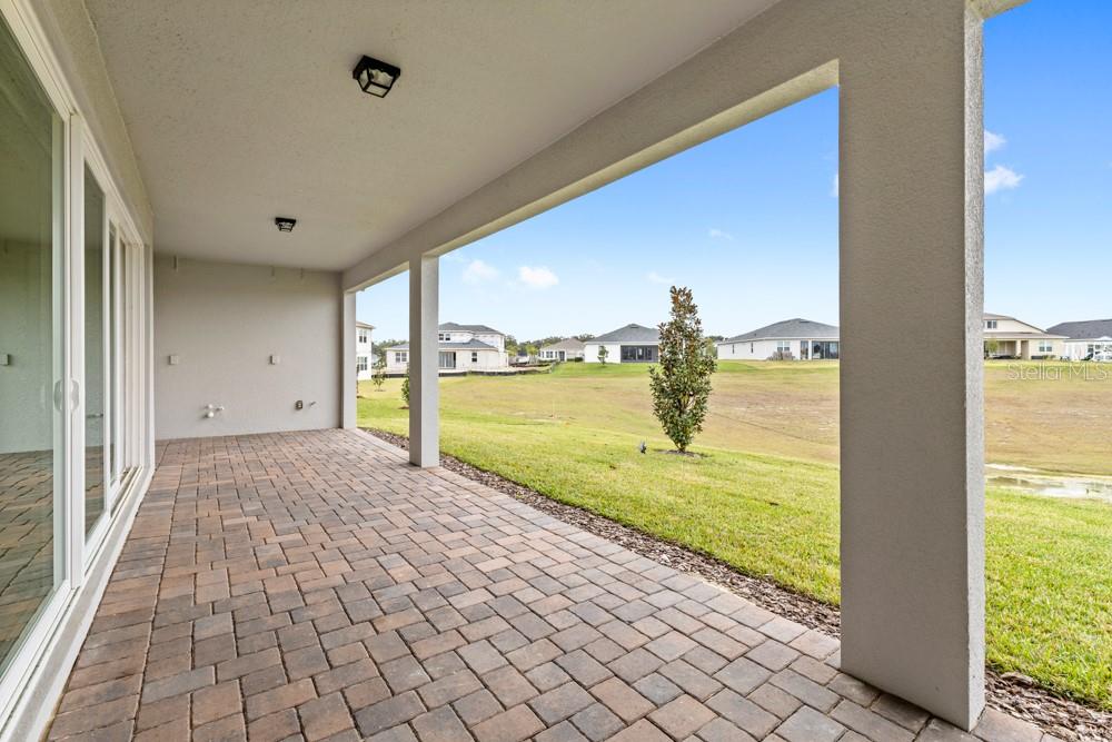 5148 Foothills Preserve Loop Mount Dora, FL 32757 - Photo 35 of 54 a view of a living room and floor to ceiling window