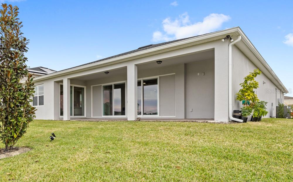 5148 Foothills Preserve Loop Mount Dora, FL 32757 - Photo 37 of 54 view of house with yard