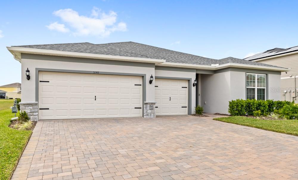 5148 Foothills Preserve Loop Mount Dora, FL 32757 - Photo 42 of 54 a view of a house with a garage