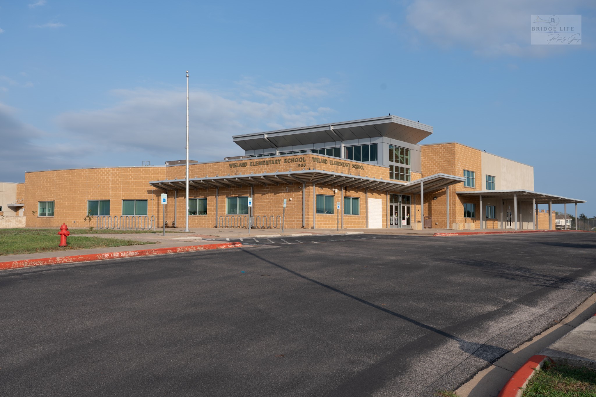 812 Battenburg Trail Pflugerville, TX 78660 - Photo 27 of 29 a front view of a building with parking lot