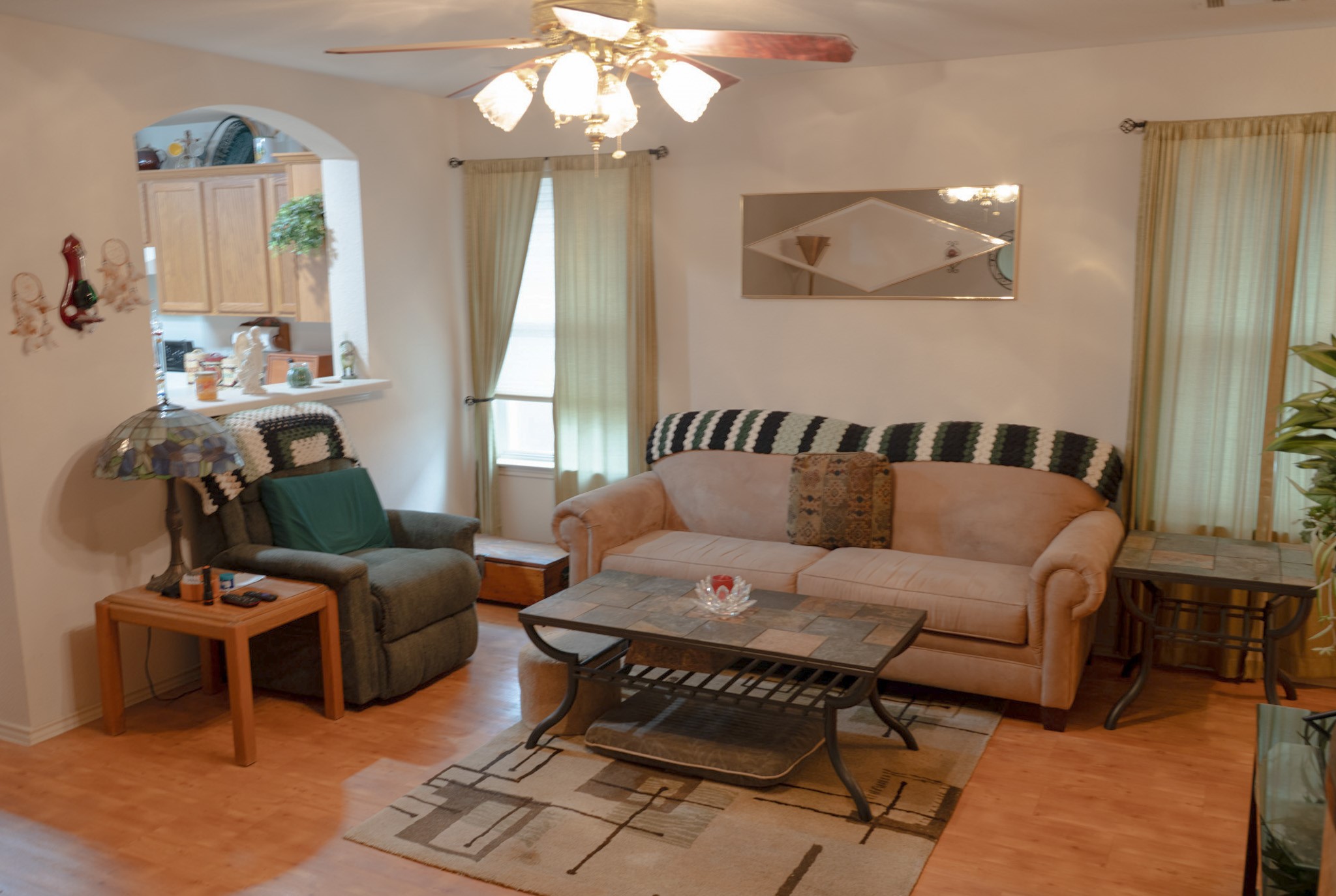 812 Battenburg Trail Pflugerville, TX 78660 - Photo 7 of 29 a living room with furniture and a chandelier