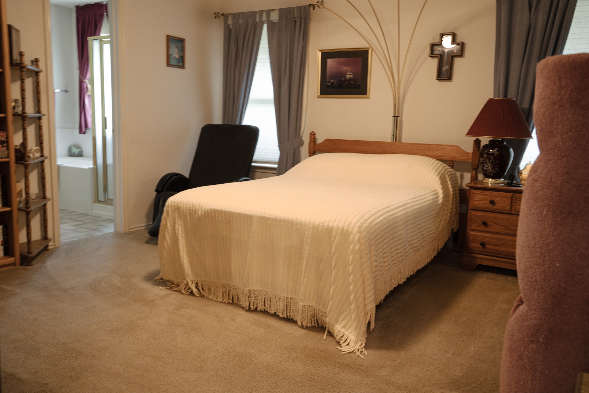 812 Battenburg Trail Pflugerville, TX 78660 - Photo 9 of 29 a bedroom with a bed and wooden floor