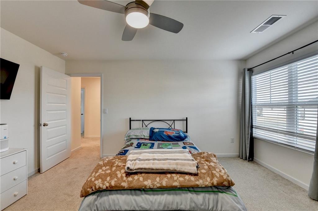 86 Canyon Ferry Way Hoschton, GA 30548 - Photo 15 of 61 a bedroom with a bed and window