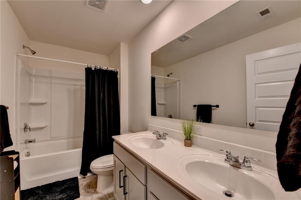 86 Canyon Ferry Way Hoschton, GA 30548 - Photo 17 of 61 a bathroom with a sink toilet tub and shower