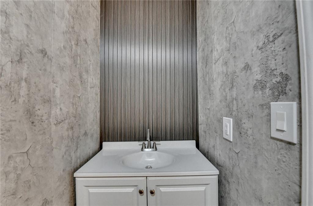 86 Canyon Ferry Way Hoschton, GA 30548 - Photo 31 of 61 a bathroom with a sink and a mirror