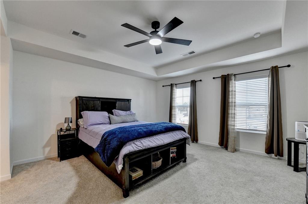 86 Canyon Ferry Way Hoschton, GA 30548 - Photo 32 of 61 a bedroom with a bed and window