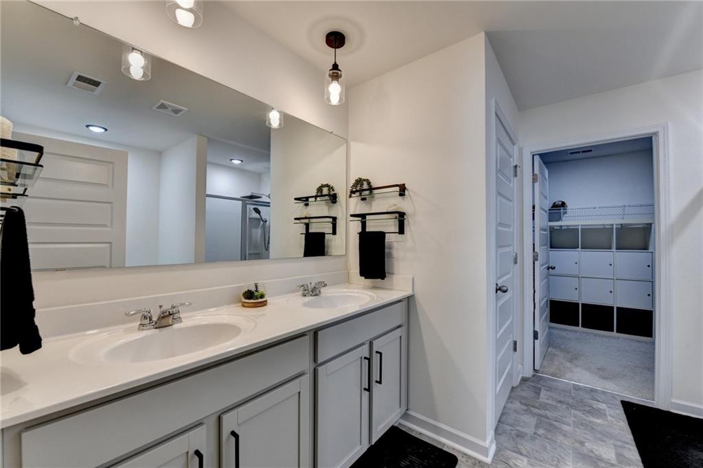 86 Canyon Ferry Way Hoschton, GA 30548 - Photo 37 of 61 a bathroom with a sink double vanity and a shower