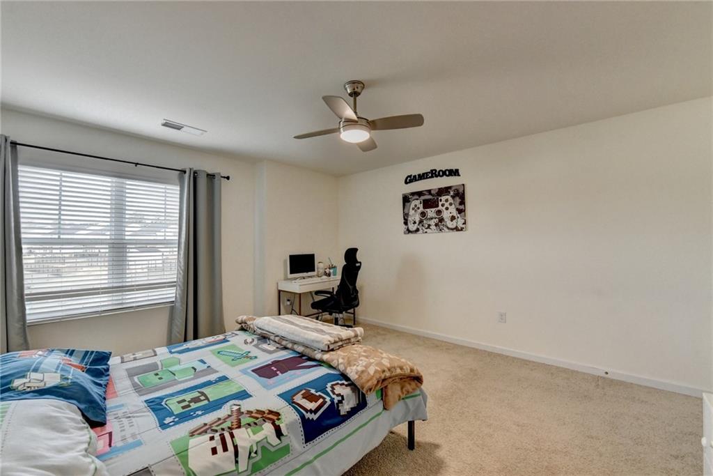 86 Canyon Ferry Way Hoschton, GA 30548 - Photo 43 of 61 a bedroom with a bed and a window
