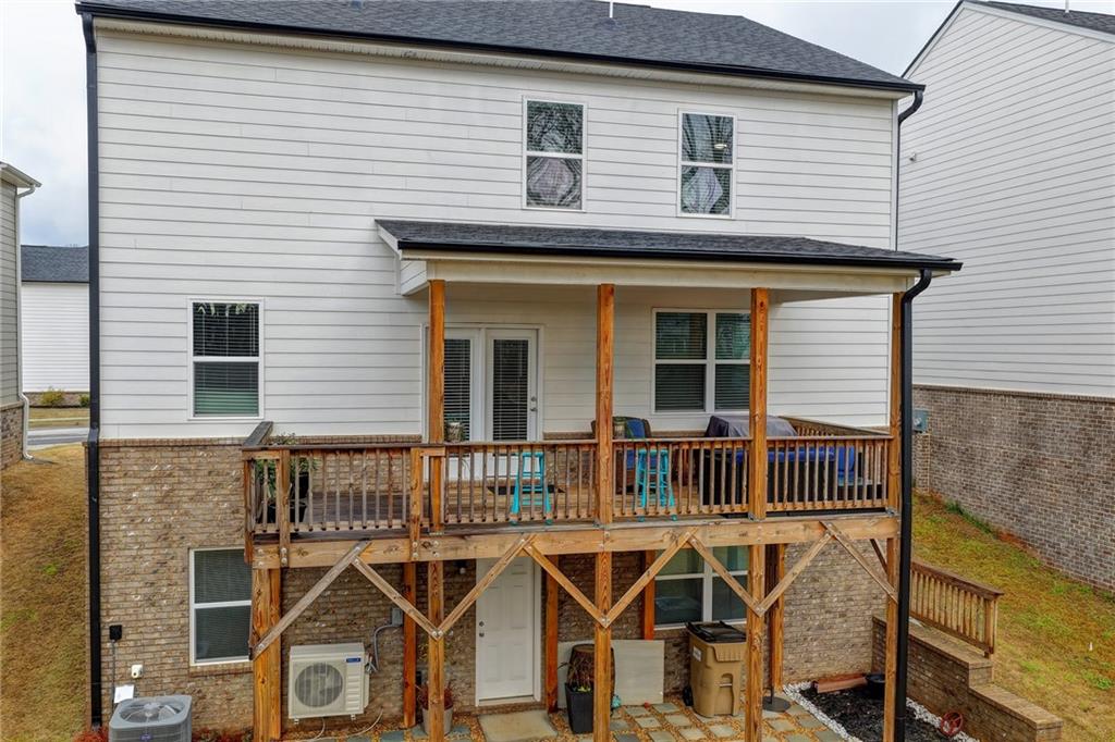 86 Canyon Ferry Way Hoschton, GA 30548 - Photo 50 of 61 a front view of a house with balcony