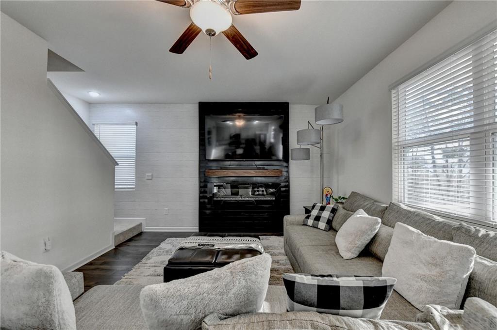 86 Canyon Ferry Way Hoschton, GA 30548 - Photo 9 of 61 a living room with furniture and a flat screen tv