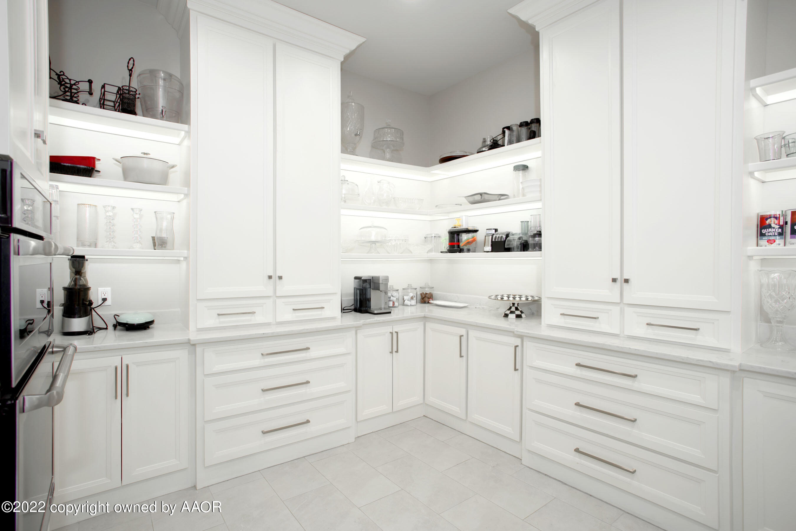 9101 Blackhawk Road Amarillo, TX 79119 - Photo 18 of 73 a kitchen with cabinets appliances a sink and a window