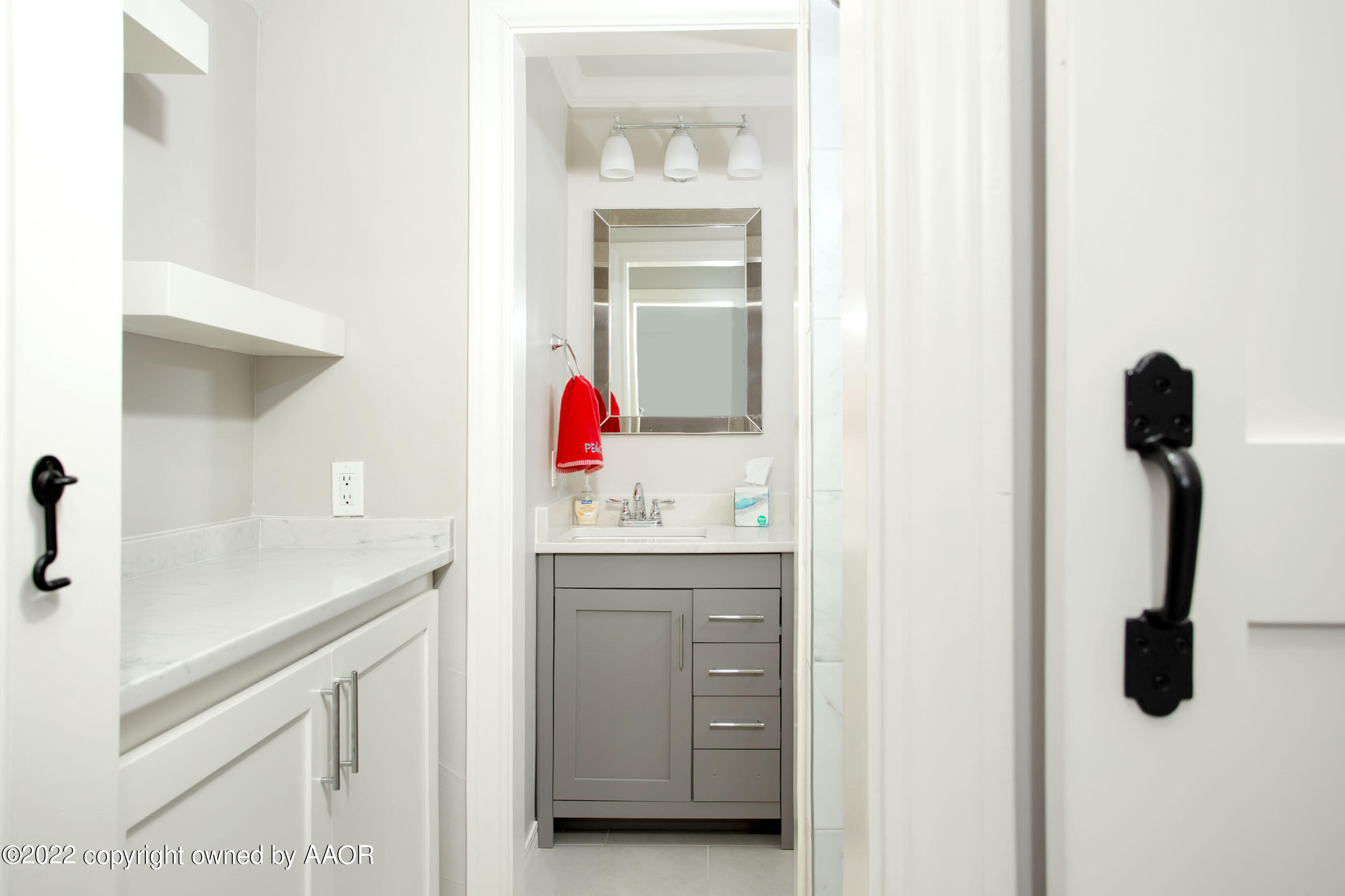 9101 Blackhawk Road Amarillo, TX 79119 - Photo 37 of 73 a bathroom with a sink and a mirror