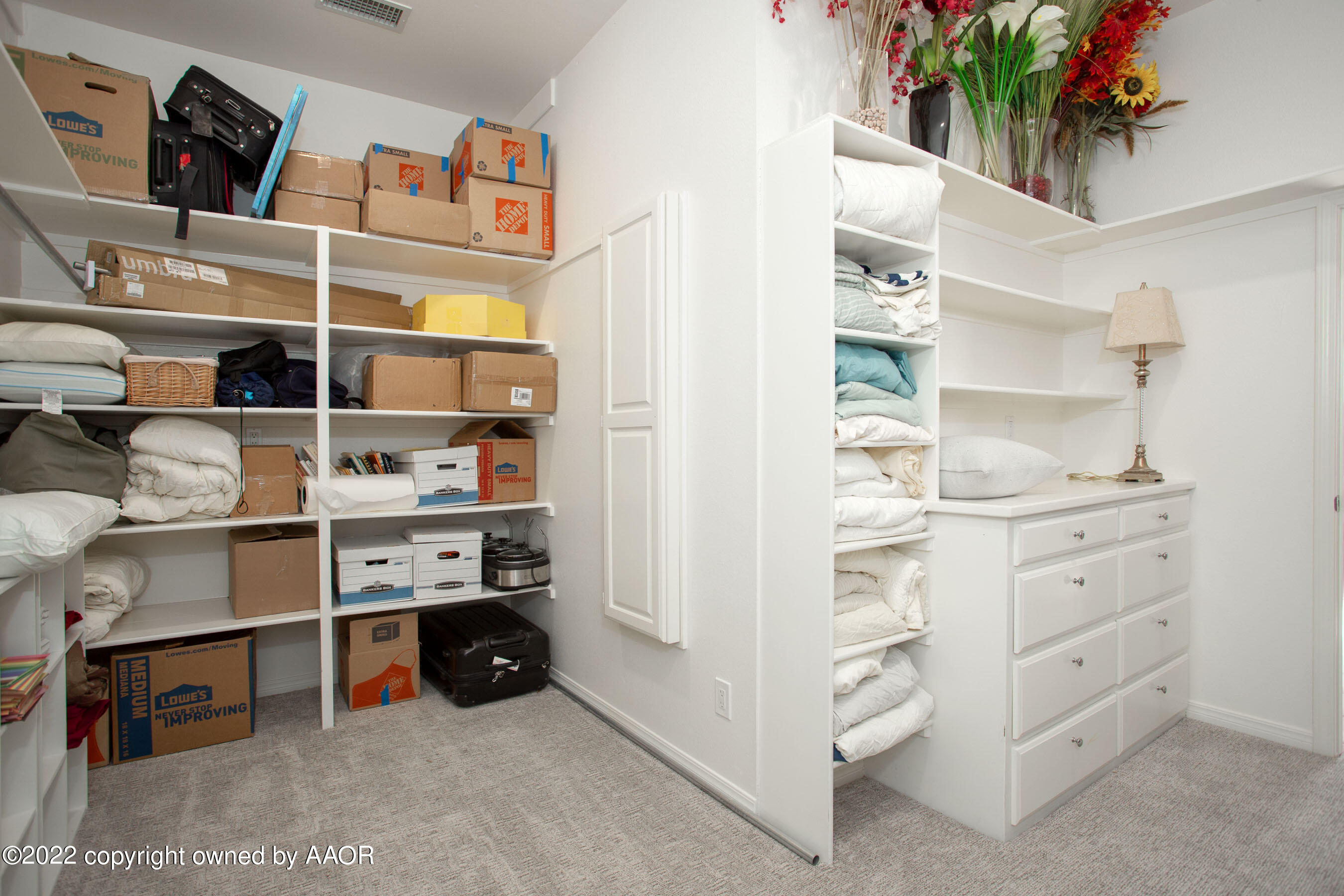 9101 Blackhawk Road Amarillo, TX 79119 - Photo 42 of 73 a view of walk in closet with clothes and racks