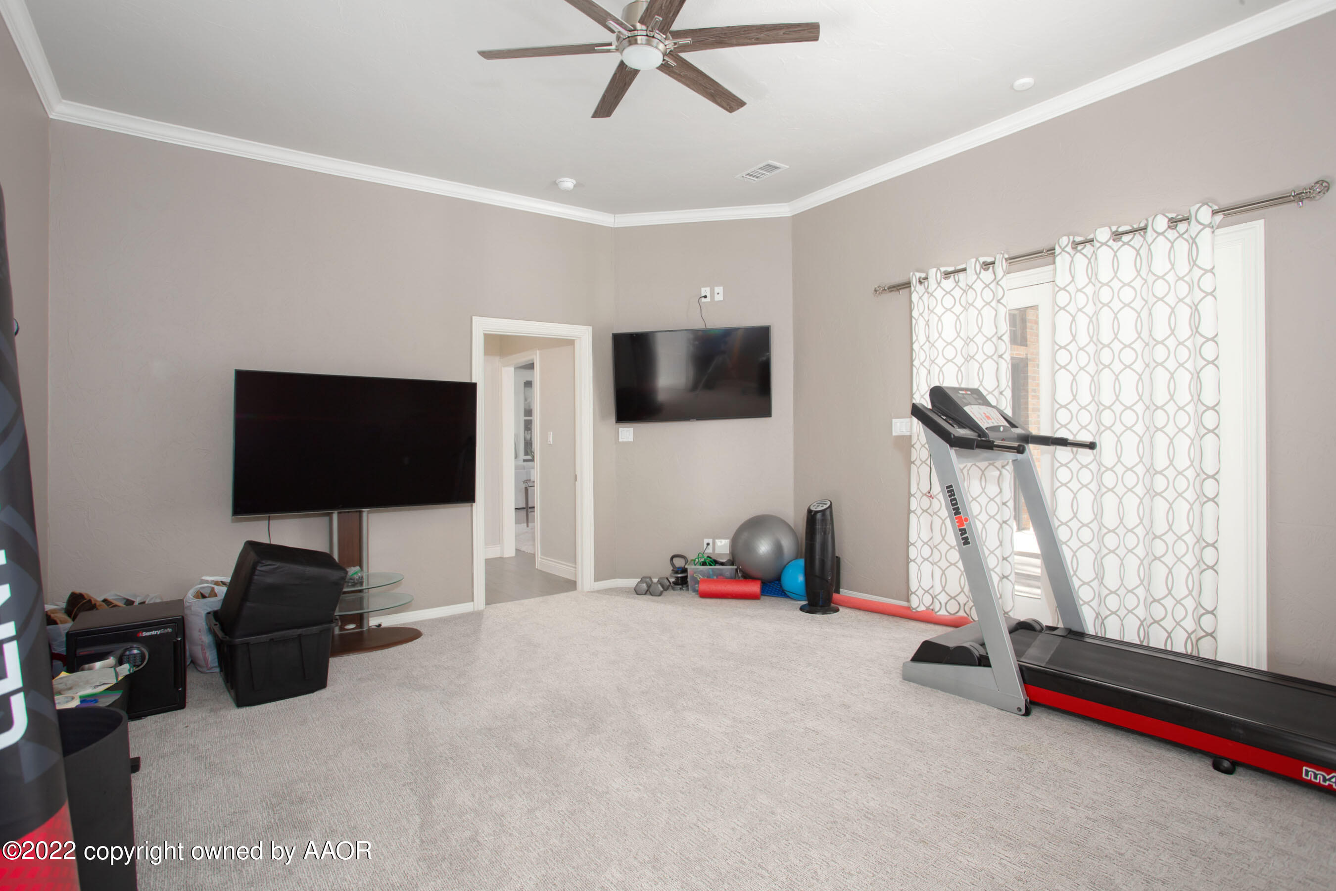 9101 Blackhawk Road Amarillo, TX 79119 - Photo 47 of 73 a bedroom with furniture and a flat screen tv