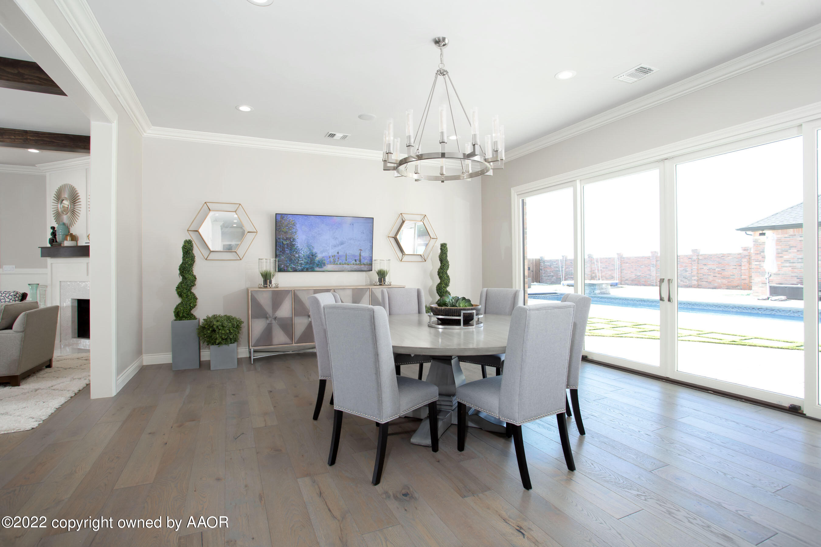 9101 Blackhawk Road Amarillo, TX 79119 - Photo 48 of 73 a view of a dining room with furniture window and wooden floor