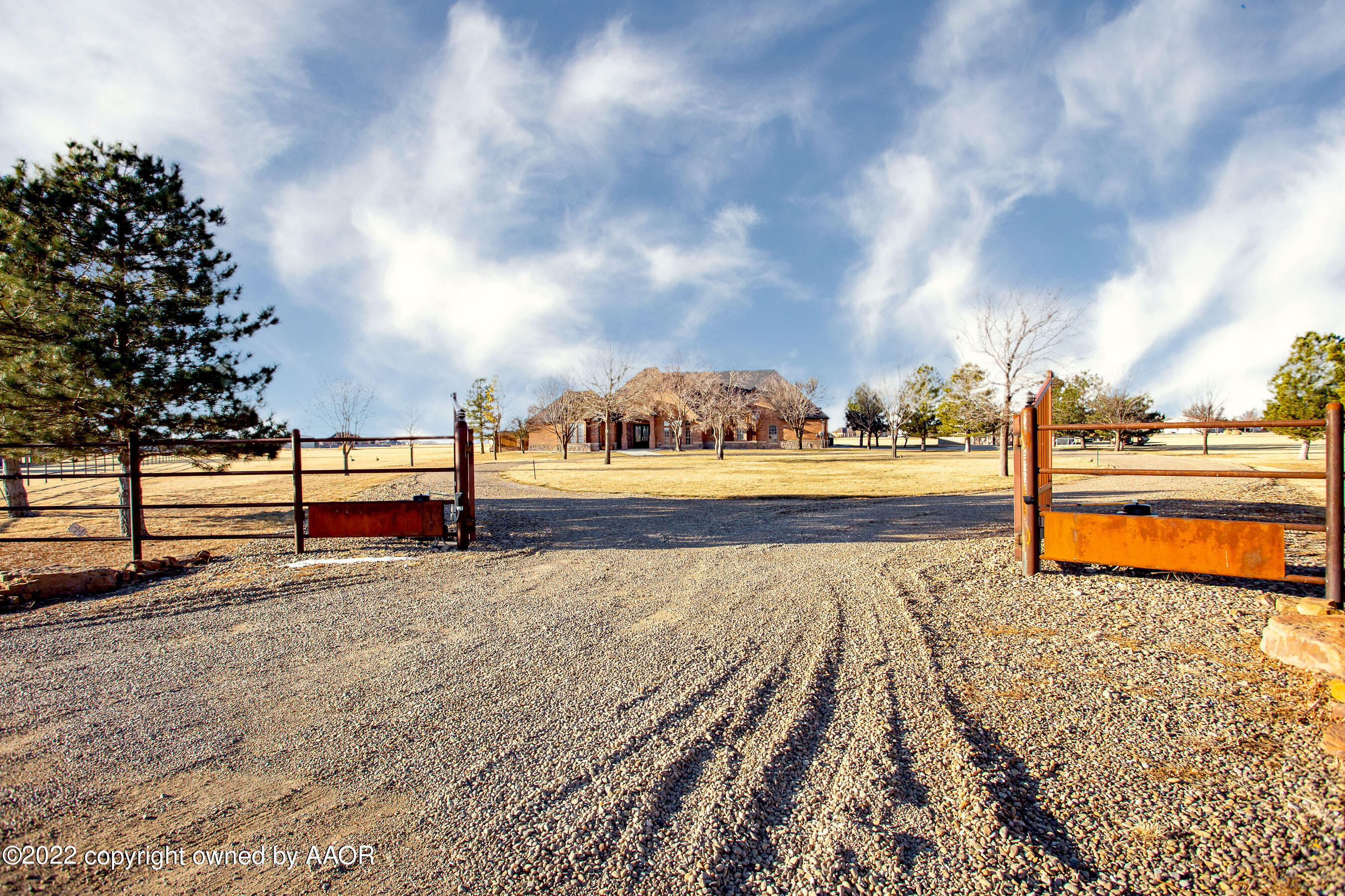 9101 Blackhawk Road Amarillo, TX 79119 - Photo 5 of 73 a view of a pathway with a wrought fence