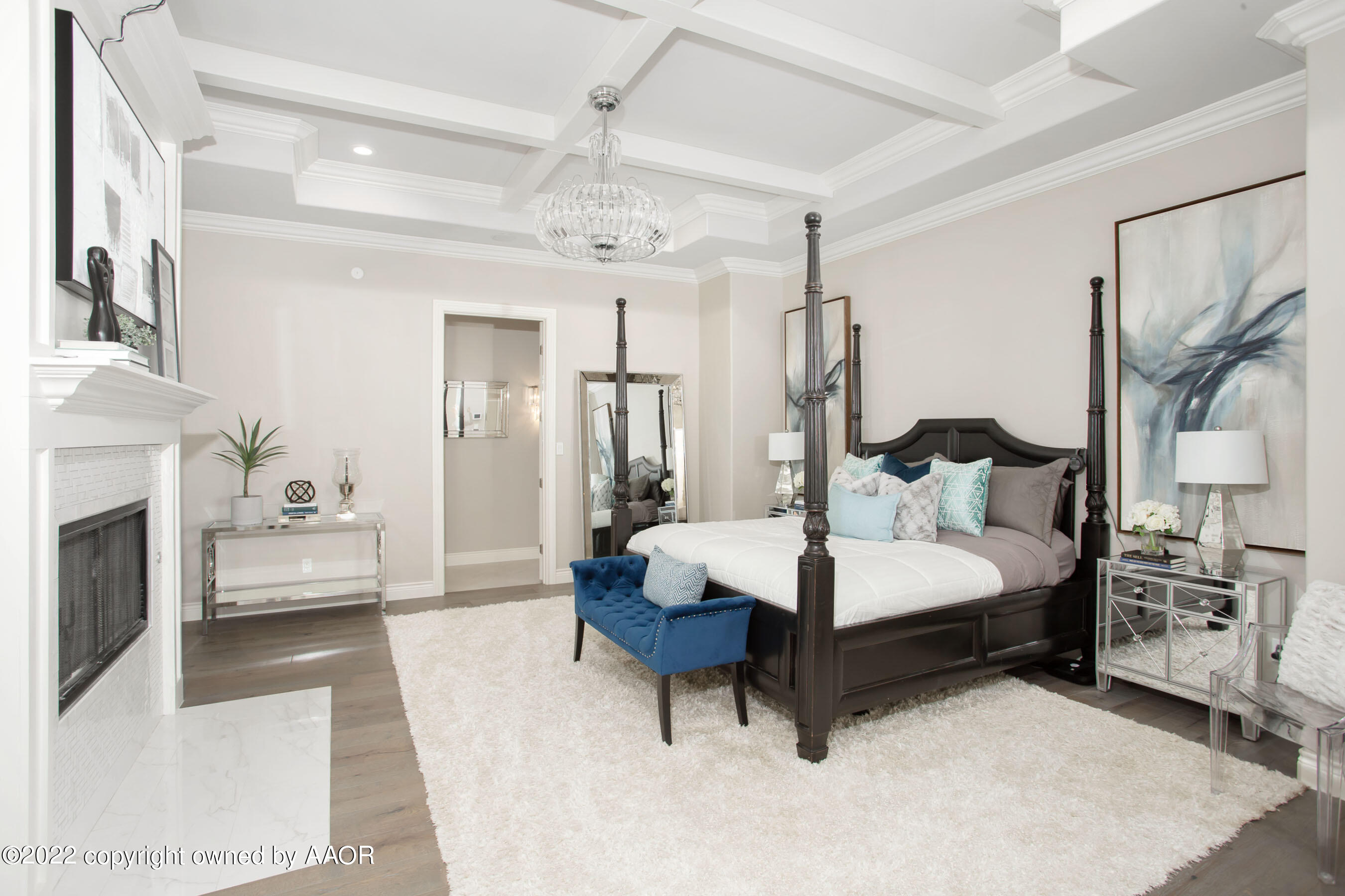 9101 Blackhawk Road Amarillo, TX 79119 - Photo 54 of 73 a living room with furniture a fireplace and a chandelier