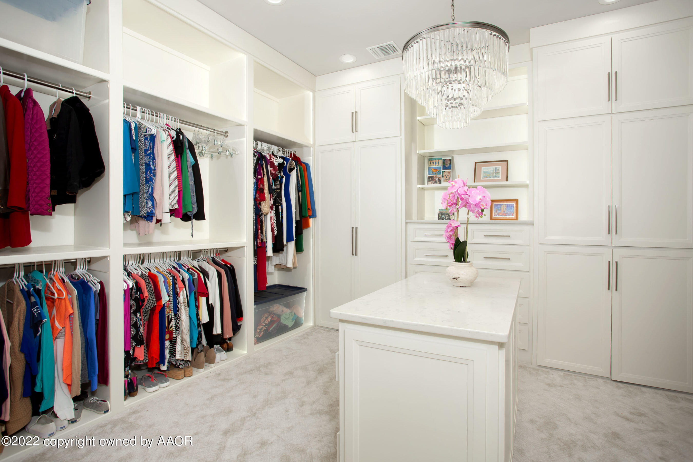 9101 Blackhawk Road Amarillo, TX 79119 - Photo 59 of 73 a view of walk in closet with clothes and shoes
