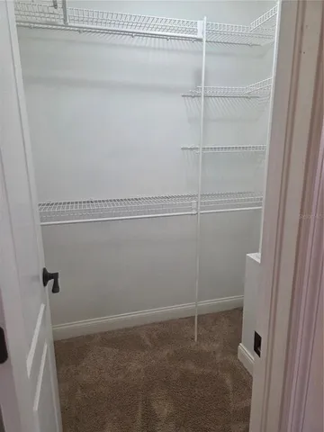 a view of a room with racks on the wall