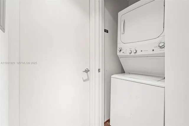 a view of bathroom with washer and dryer