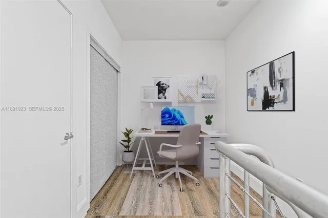 a workspace with furniture and wooden floor