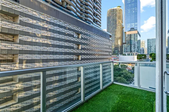a balcony with view of swimming pool