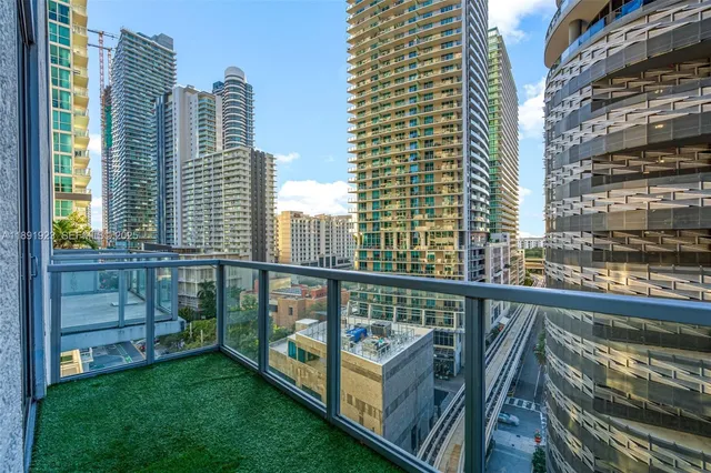 a view of balcony with two chairs and a table