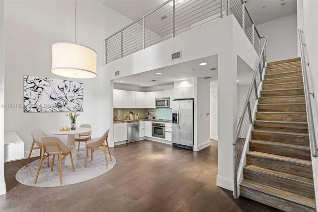 a view of kitchen with furniture and wooden floor