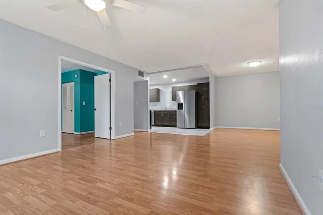a kitchen with a refrigerator and a sink