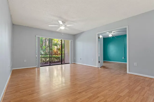 a view of a kitchen with a refrigerator and a sink