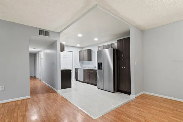 a kitchen that has a sink and a stove