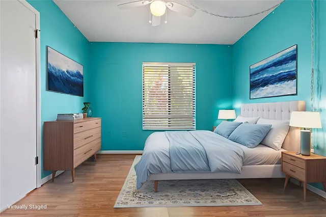 a view of a room with wooden floor and windows