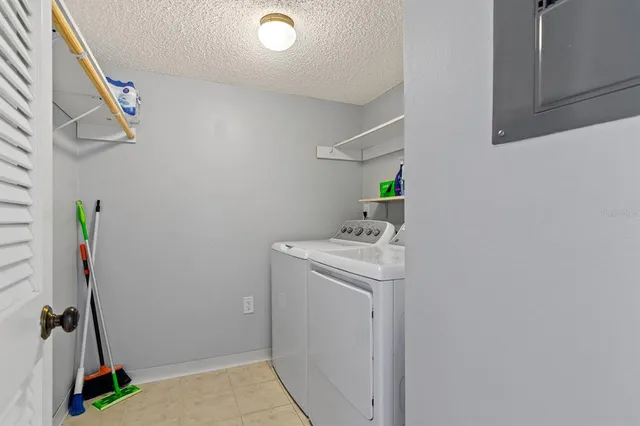 a view of a lake with houses in the background