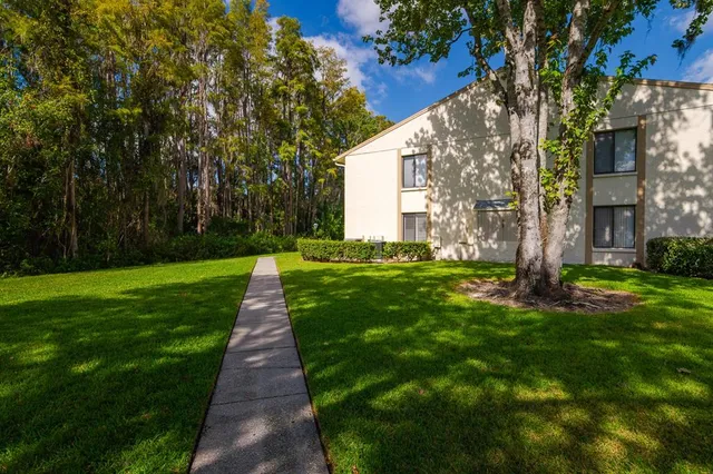an aerial view of residential house with outdoor space and swimming pool