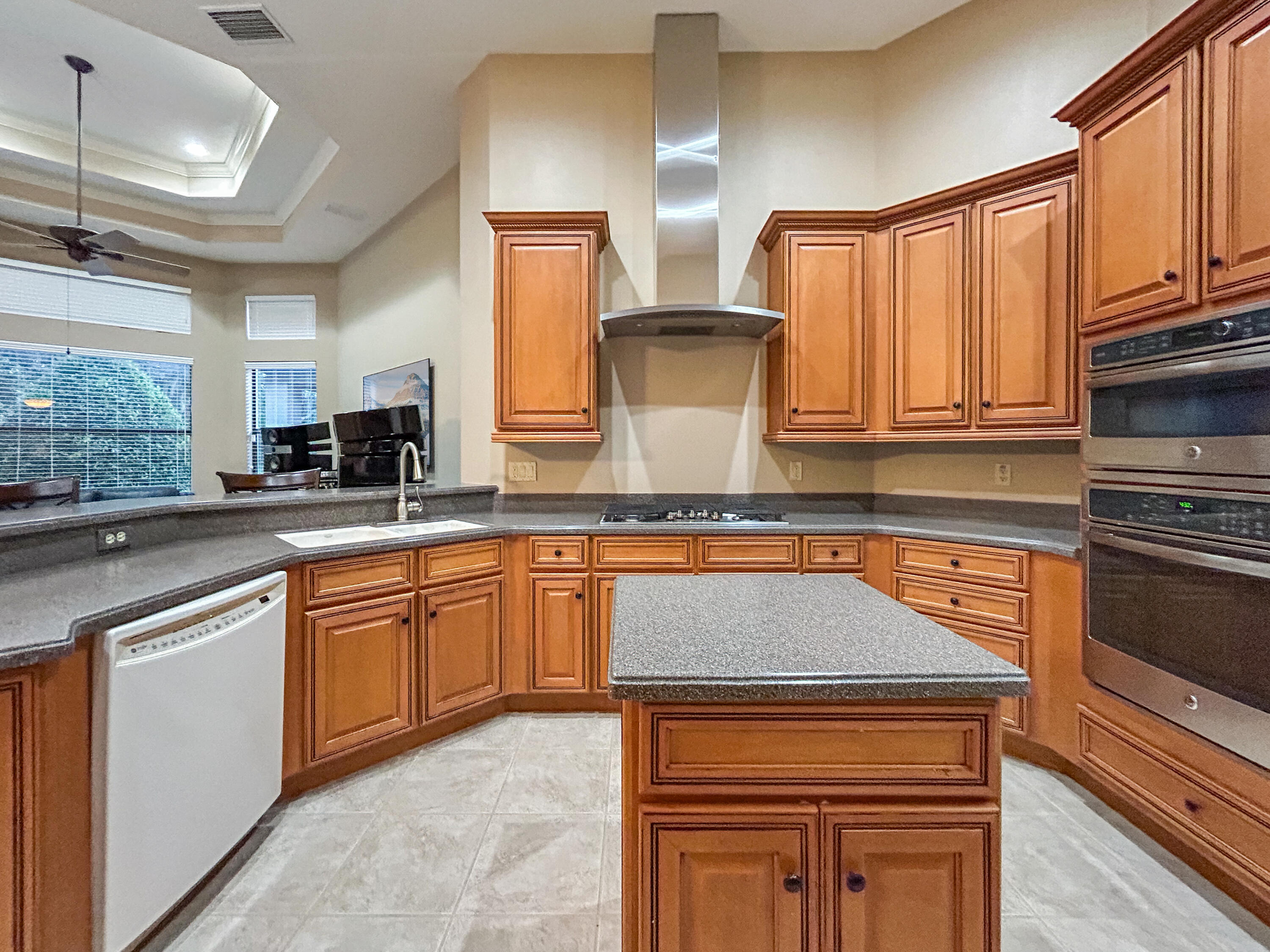 26345 San Gabriel Howey-in-the-Hills, FL 34737 - Photo 24 of 51 a kitchen with granite countertop a stove sink and microwave