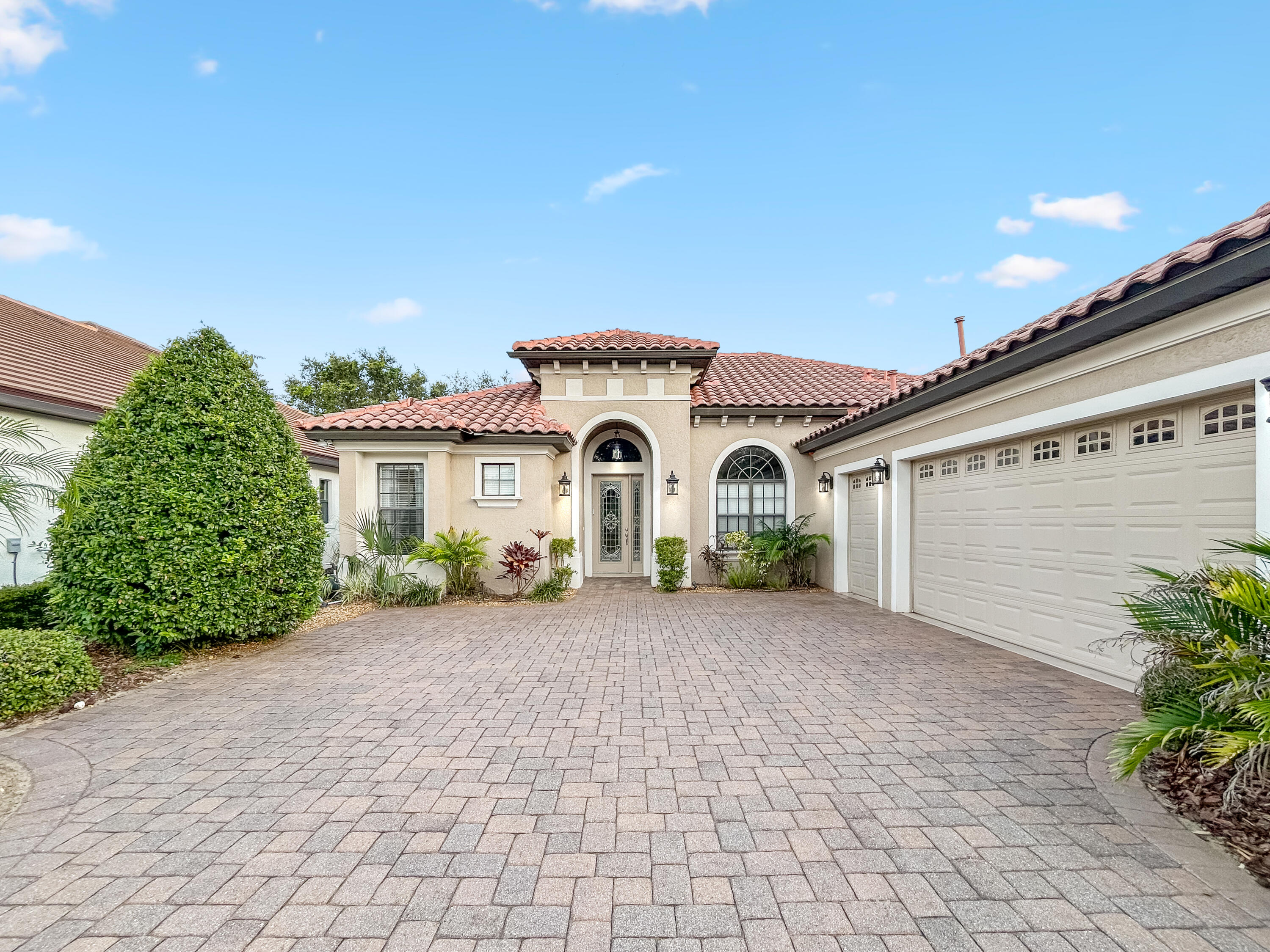 26345 San Gabriel Howey-in-the-Hills, FL 34737 - Photo 3 of 51 a view of a house with a yard and potted plants
