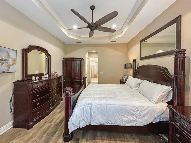 a bedroom with a bed and a dresser