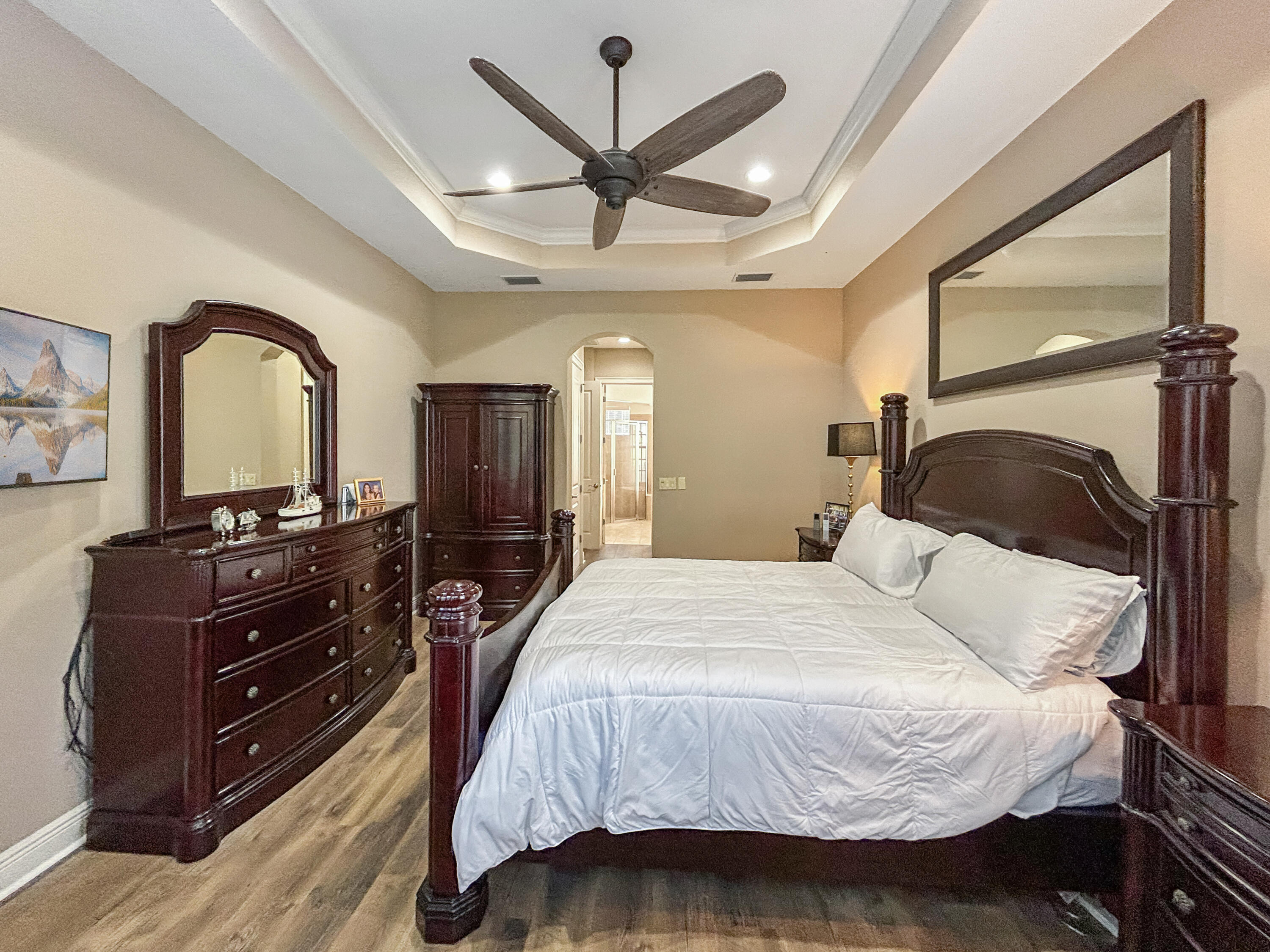 26345 San Gabriel Howey-in-the-Hills, FL 34737 - Photo 31 of 51 a bedroom with a bed and a dresser