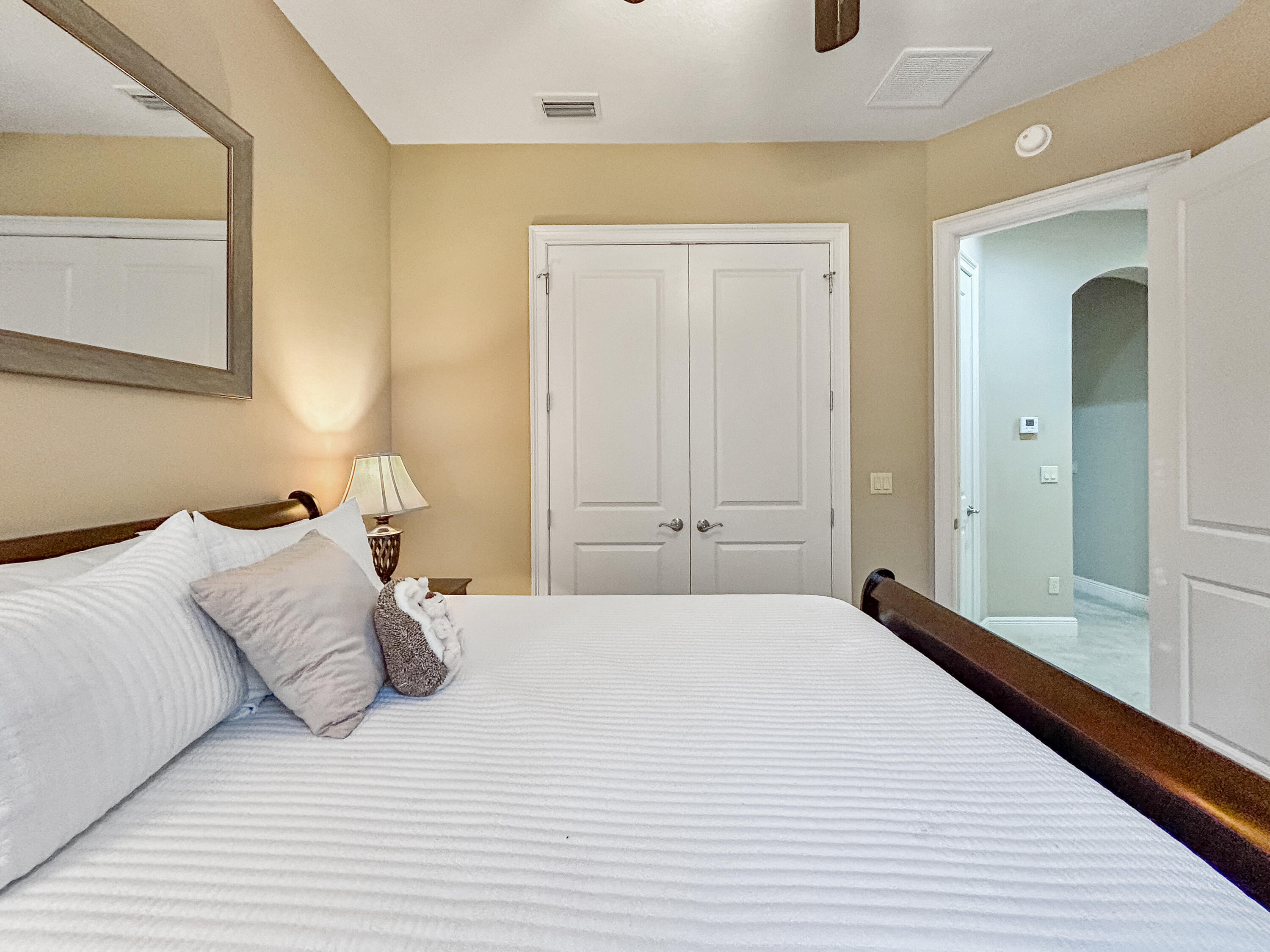 26345 San Gabriel Howey-in-the-Hills, FL 34737 - Photo 36 of 51 a bedroom with a large bed and a wooden floor