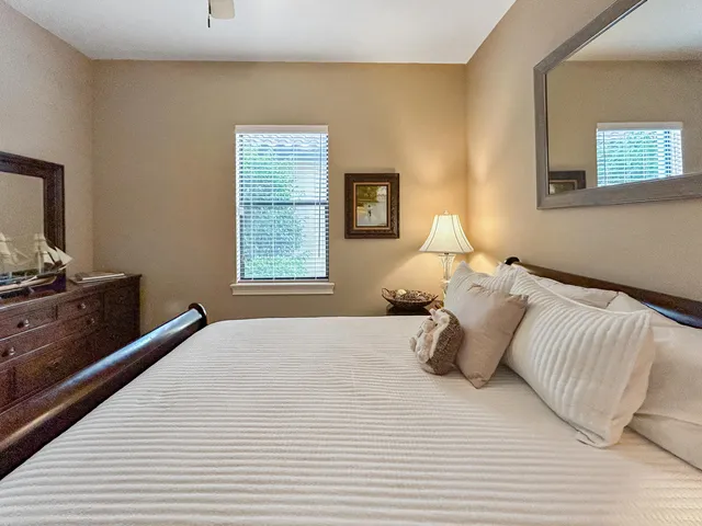 a large bed in a white room